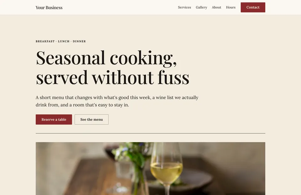 Restaurant template: a cream page with a serif headline, a reserve-a-table button and a photo of a set table